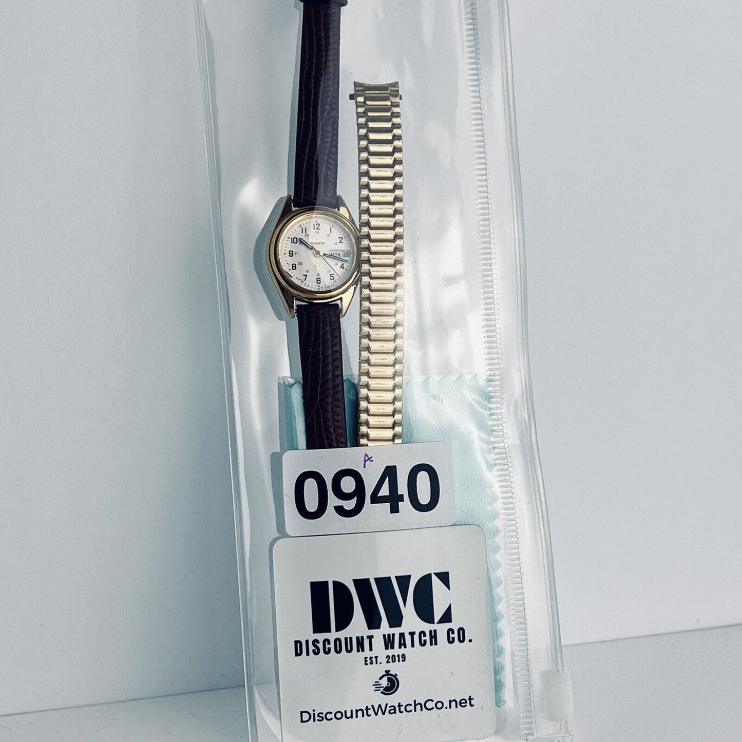 Seiko Dual Day Women’s Dress Watch Gold Tone 24mm Case Embossed Leather Bands English Spanish