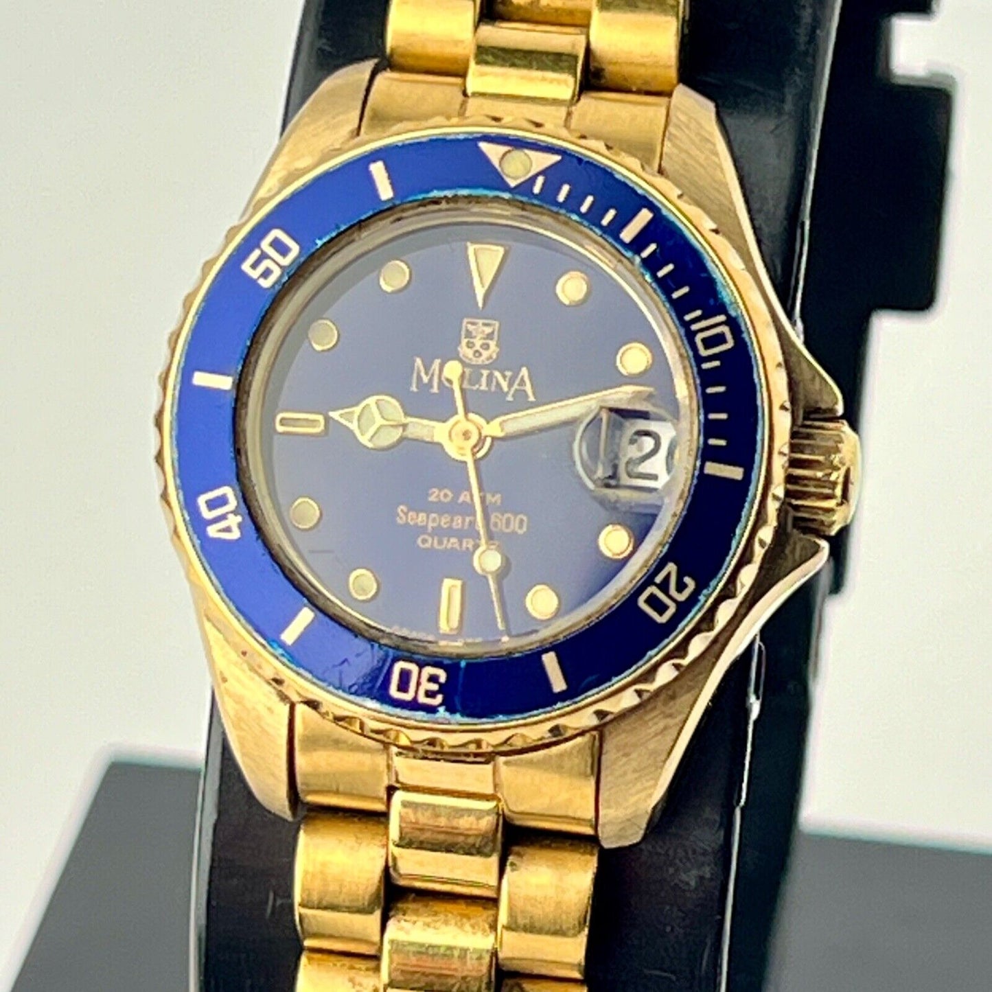 Molina Sea Pearl Date Watch Womens Swiss Made Blue Rotating Bezel Golden Bracele