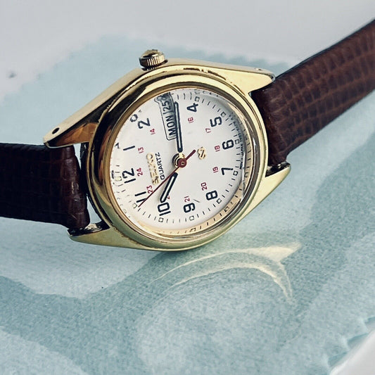 Seiko Dual Day Women’s Dress Watch Gold Tone 24mm Case Embossed Leather Bands English Spanish