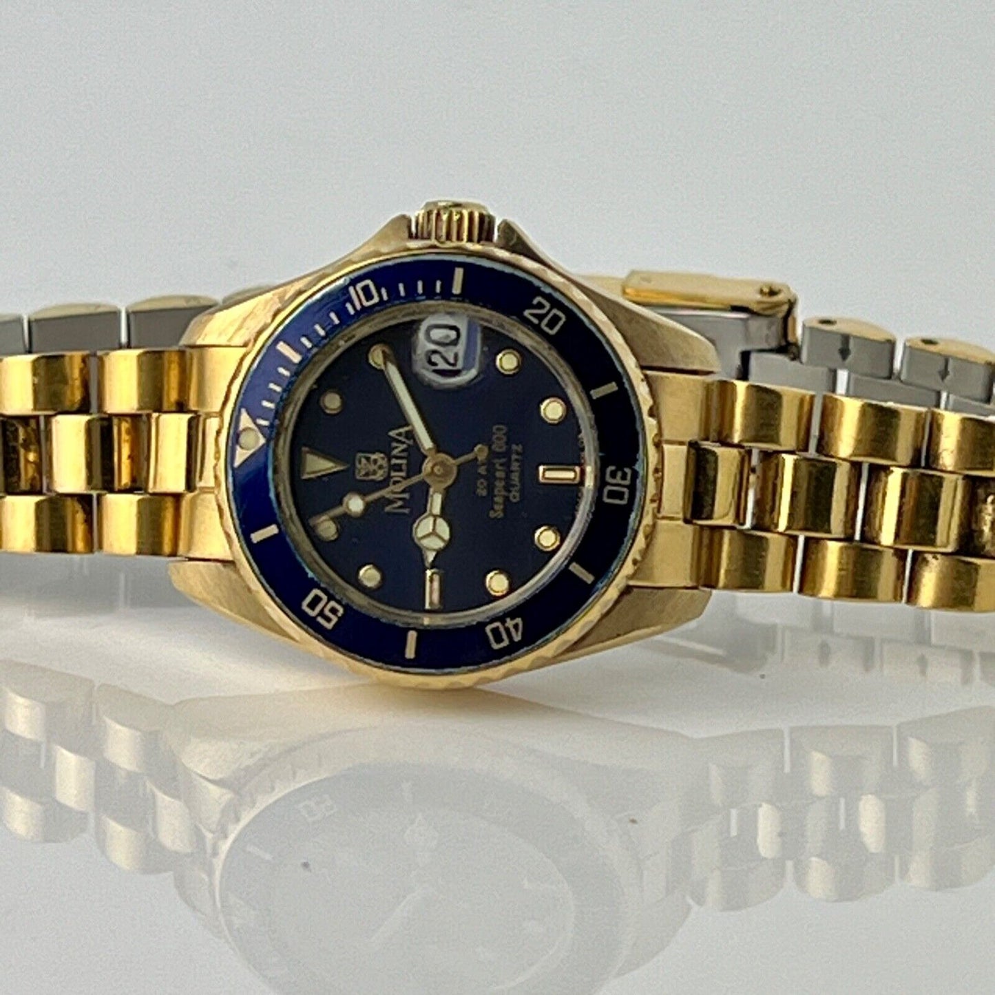 Molina Sea Pearl Date Watch Womens Swiss Made Blue Rotating Bezel Golden Bracele